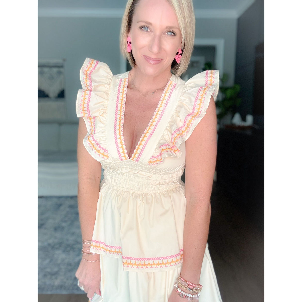 women's boutique cream dress closeup