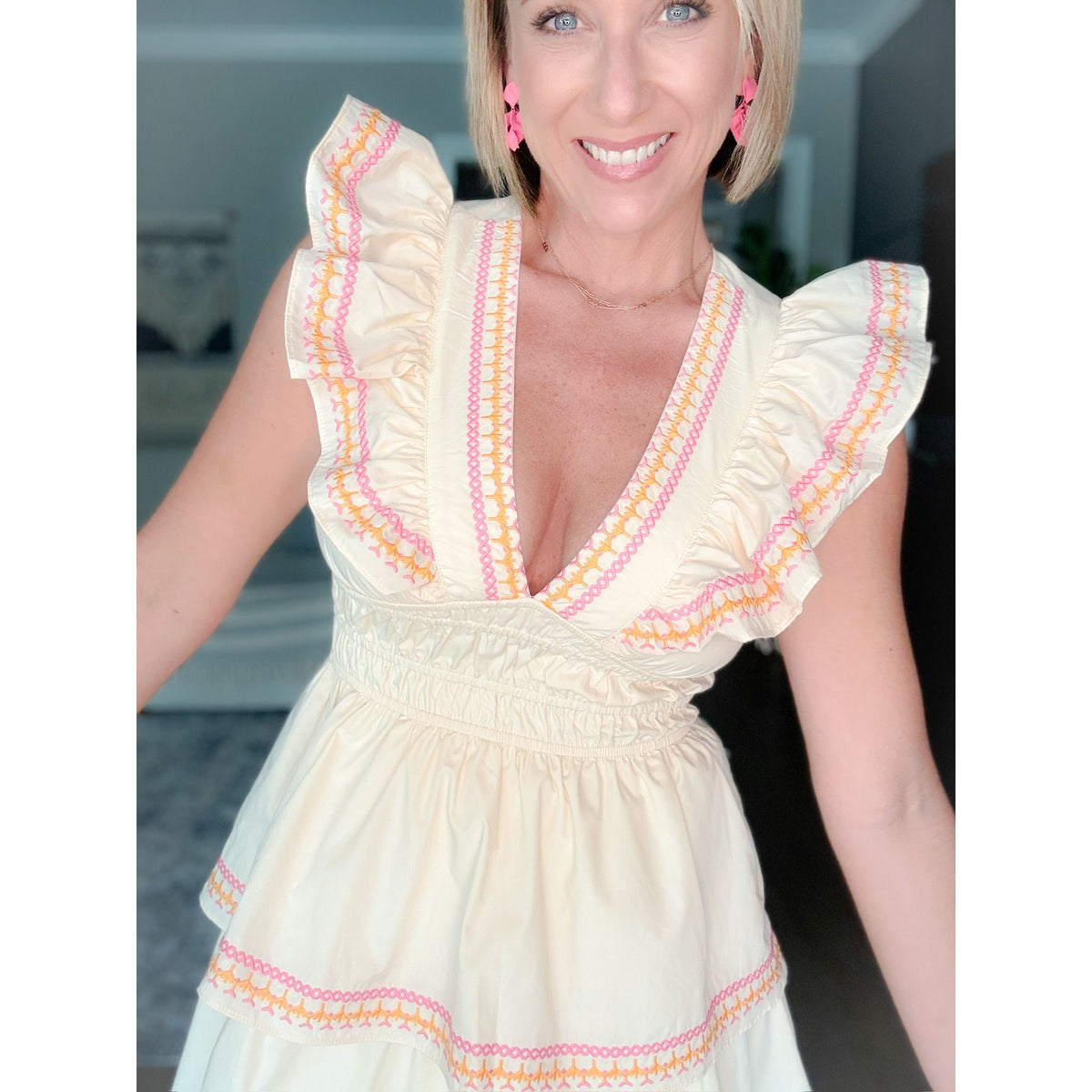 women's boutique cream dress neckline