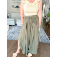 Women's boutique flowy green pants front