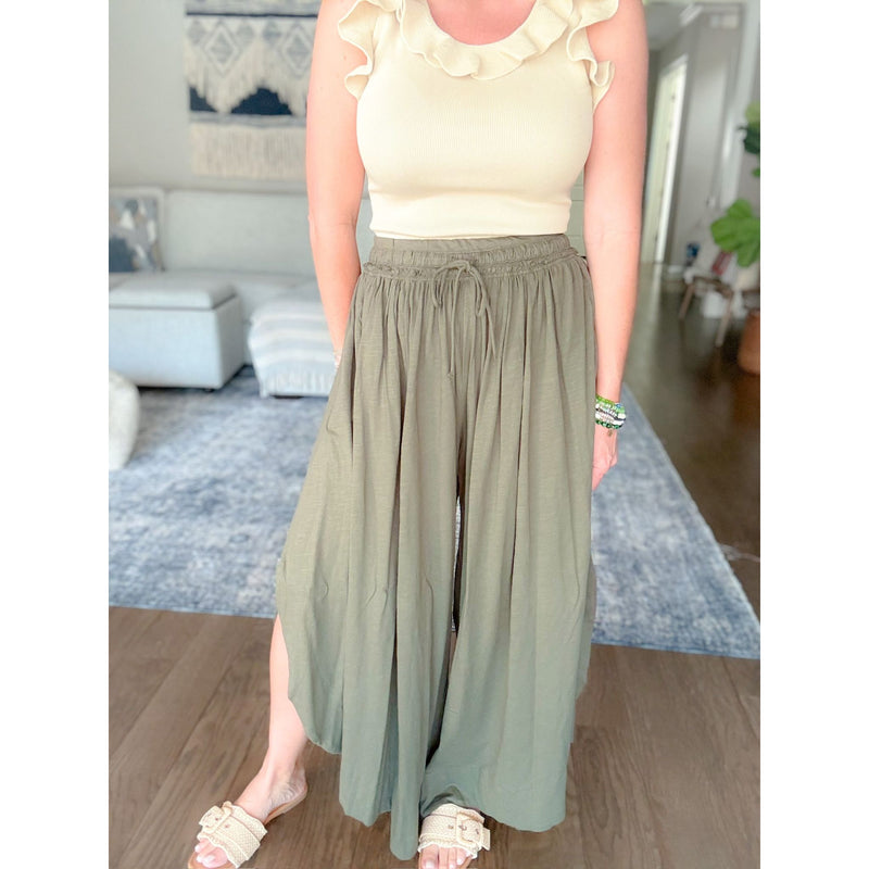 Women's boutique flowy green pants front