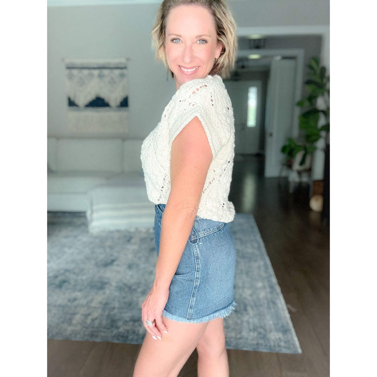 women's boutique sweater cream side