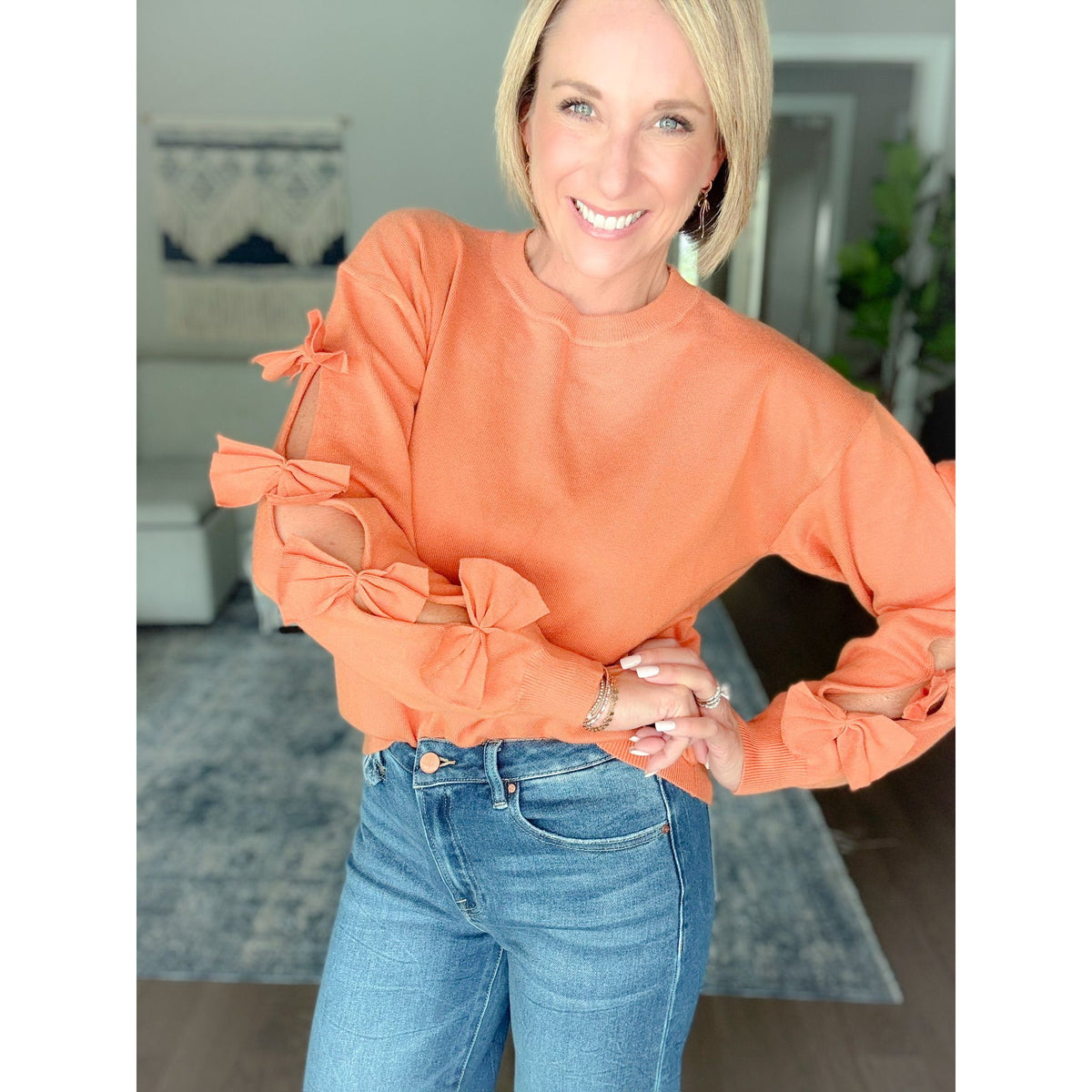 Women's boutique bow sweater burnt orange detailed