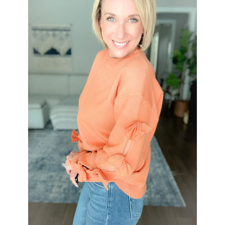 Women's boutique bow sweater burnt orange side bows